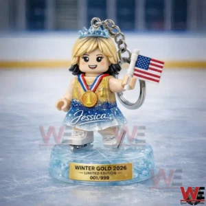 Mini skating figure keychain holding a US flag on an icy base labeled Winter Gold 2026 Limited Edition 001 of 999.