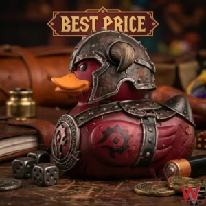 A red World of Warcraft Horde themed rubber duck wearing metal armor and a horned helmet on a desk.