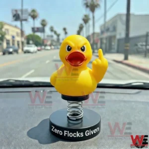 Angry yellow duck bobblehead on a car dashboard!
