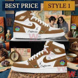 Side view of brown and white high top sneakers with custom earth logos and signatures on a black box!