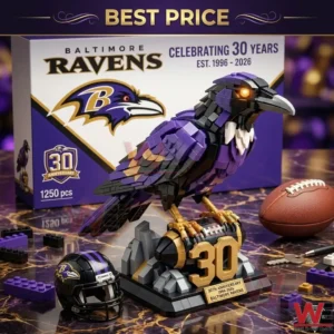Baltimore Ravens brick bird model with purple feathers perched on a base next to a team helmet and anniversary box!