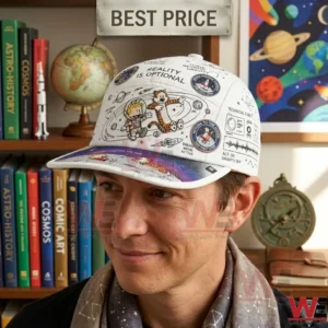 A man smiling while wearing a white cap decorated with space drawings and a boy and tiger patch!