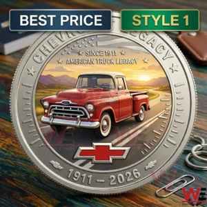 A silver anniversary coin for Chevrolet featuring a red vintage truck and mountain scenery.
