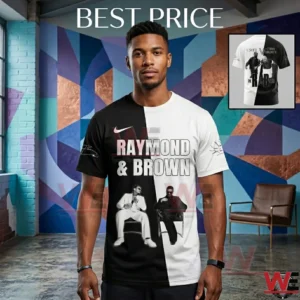 A single photograph of a black man modeling a black and white vertically split t shirt! He stands alone in an artistic loft with geometric wall murals! The man faces the camera with his hands at his side wearing black pants and a watch! The shirt front has white text Raymond and Brown and small photos! A small picture inset in the corner shows the back design of the same split t shirt!