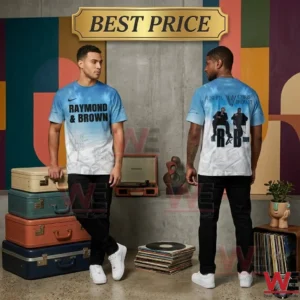 A full length photo of two black male models in a room decorated with vintage luggage and records! On the left a model faces the camera and leans against stacked colorful suitcases showing a light blue and white tie dye t shirt with black text Raymond and Brown! On the right another model turns away to display the back of the matching tie dye shirt which has Chris Brown and Usher text and a black and white photo of them seated!