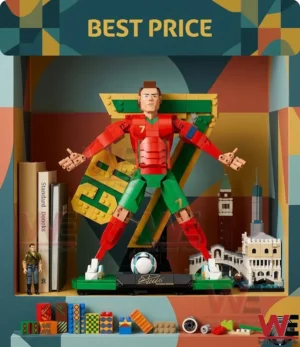 A celebratory Lego soccer player figure stands in a display case with miniature buildings and books in the background.