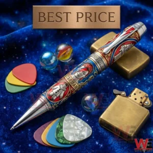 Close up shot of a highly detailed David Bowie commemorative pen resting on blue velvet next to colorful guitar picks and a brass lighter!