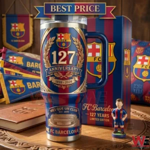 A large blue and red striped commemorative tumbler cup for a football club with a matching box and a small player figure on a table!