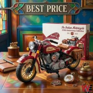 A classic red Indian Motorcycle model displayed with a gold pocket watch and a leather notebook on a polished table.