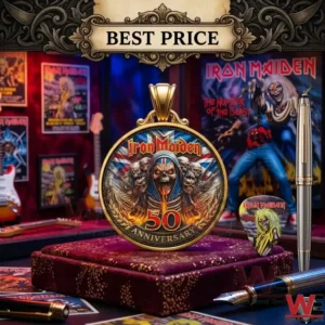 Iron Maiden 50th Anniversary Coin 4 Gold anniversary medallion on a velvet pillow with a pen and posters nearby!