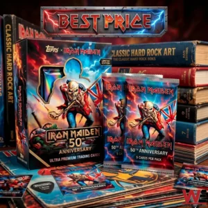 The image shows a Topps and Iron Maiden collaboration for a limited edition 50th anniversary trading card set. The main collector box is black and features vibrant artwork of Eddie the mascot in his red coat holding a Union Jack flag from The Trooper. Next to the box are two sealed silver foil packs also showing the anniversary branding and stating five cards per pack. Scattered around are individual trading cards and a black guitar pick. The background includes a tall stack of books with titles like Classic Hard Rock Art on their spines. A metallic sign with lightning bolt effects is located at the top.