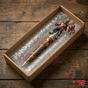An Iron Maiden themed collector pen packed for shipping inside a cardboard box with protective bubble wrap on a wooden table!