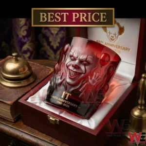 A detailed red glass showing Pennywise inside a luxurious cherry wooden presentation box on a vintage desk.
