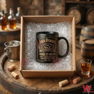 A black Jack Daniels collector mug inside a shipping box placed on a wooden barrel in a rustic cellar!