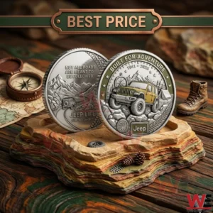 Side by side view of two commemorative Jeep coins with mountain and vehicle engravings on a rock display!