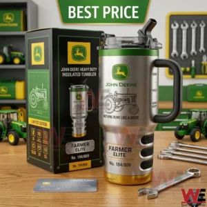 A limited edition John Deere Farmer Elite tumbler and its original packaging are displayed on a wooden surface with a wrench and credit card in a workshop setting!