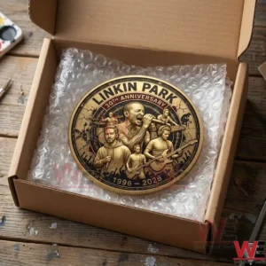 Thirtieth anniversary gold coin resting in a shipping box on a wooden workbench!