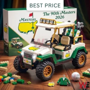 A commemorative Masters 2026 golf cart brick model shown with its box golf accessories and a miniature green jacket on a wooden floor.