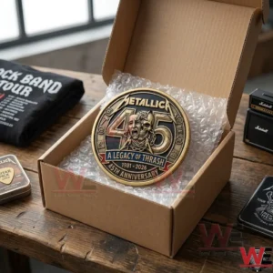 Overhead shot of a Metallica anniversary coin packaged in a cardboard box for shipping!