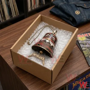 An overhead view of a Metallica commemorative bell inside a cardboard box for shipping!