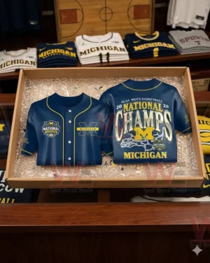 A navy Michigan championship jersey packed in bubble wrap inside a cardboard box on a store counter.