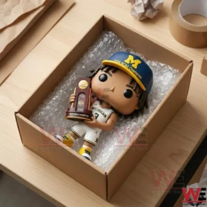Collectible figure of a Michigan basketball player lying in a bubble wrap filled shipping box.