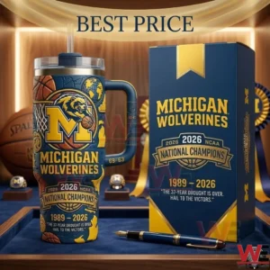 A Michigan Wolverines championship tumbler and box set with a pen on a display surface!