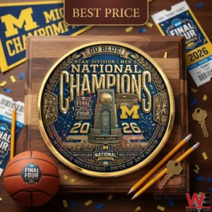 A mounted gold and blue Michigan championship plate surrounded by basketball themed items and stationery on a wooden desk.