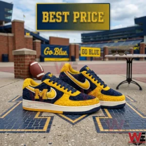 Detailed view of navy and yellow university themed sneakers on a mosaic logo outdoors!