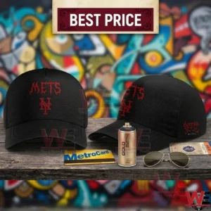 Black baseball caps with red Mets embroidery displayed on a wooden table with a spray paint can and sunglasses against a graffiti wall!