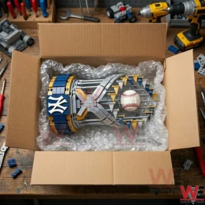 A baseball trophy building model nestled in bubble wrap inside a shipping box!