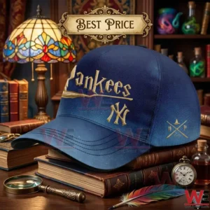 Blue gradient Yankees cap with gold wizarding world logos sitting on old books.