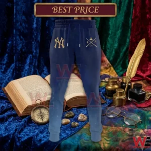 Gradient blue Yankees joggers with gold logos displayed with an old book and magical accessories.