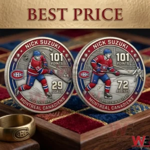 A pair of silver commemorative hockey coins for Nick Suzuki on a red and blue velvet tray!