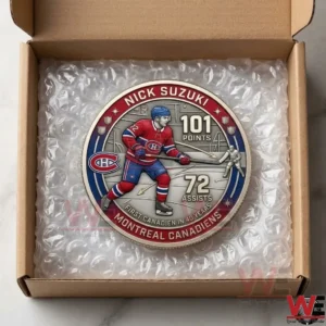 Top view of a Nick Suzuki milestone hockey coin packaged in a shipping box!