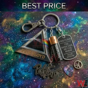 A metallic Pink Floyd keychain with multiple charms is displayed on a space themed wooden surface next to a guitar pick and a peace symbol!