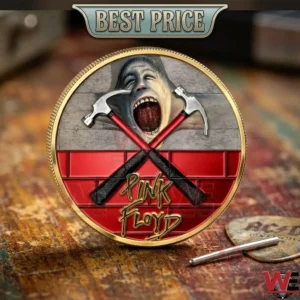 Front view of a gold Pink Floyd commemorative coin with the screaming face and crossed hammers design!