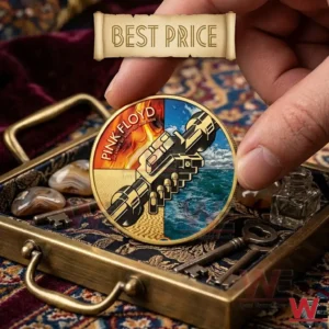 A hand holding a colorful gold Pink Floyd coin over a vintage brass tray!