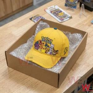 Overhead shot of a yellow Pokemon cap packaged in a cardboard box for shipping!