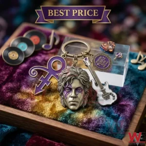 A bronze keychain with a sculpted face a purple symbol and a white guitar sits on a colorful velvet surface! The scene is decorated with small records and music notes!