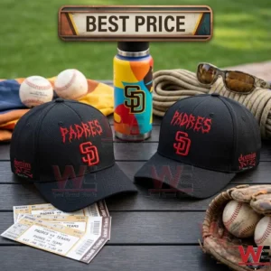 Two black Padres baseball caps with red embroidery on a wooden table with baseball tickets and a glove in an outdoor setting!