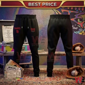 Front and back views of black joggers featuring red Padres and dominATE logos in a studio with concert and baseball gear!