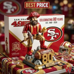 A San Francisco 49ers eighty year anniversary building block mascot standing on a football trophy base!