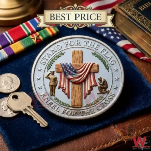 A silver religious and patriotic coin showing a cross and flag and soldier on a desk!