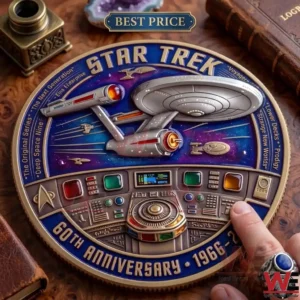 A commemorative Star Trek coin featuring a starship and a bridge console being touched by a finger!