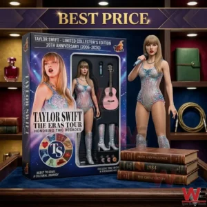 A realistic singer action figure wearing a glittery outfit standing next to its collector box and a stack of books!