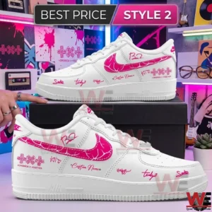 White leather shoes with pink graphic designs and signatures in a colorful studio setting!