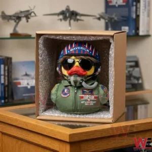 A pilot duck plush toy packed securely inside a cardboard box for shipping!
