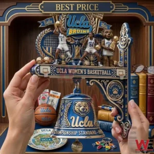 A close up of hands holding a decorative blue and gold UCLA basketball trophy with a bell and player figurines against a library backdrop!
