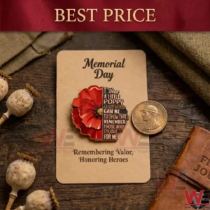 A red poppy pin on a tan card over a wooden desk!